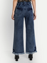Women’s high rise blue denim jeans by Ochre Ourea, size 30, displayed on a hanger with front pockets and classic stitching.