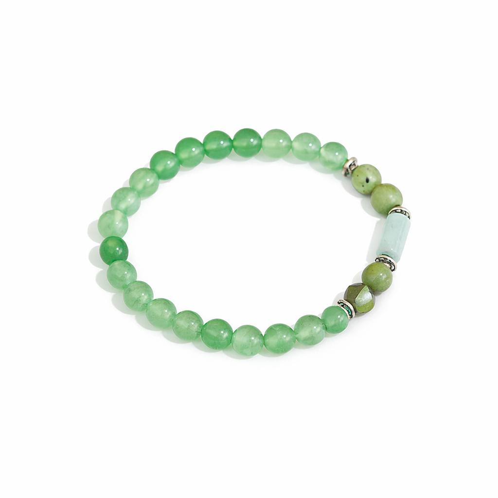 Green gemstone beaded stretch bracelet by Pear Smudge, featuring vibrant round beads in a flexible jewelry design.