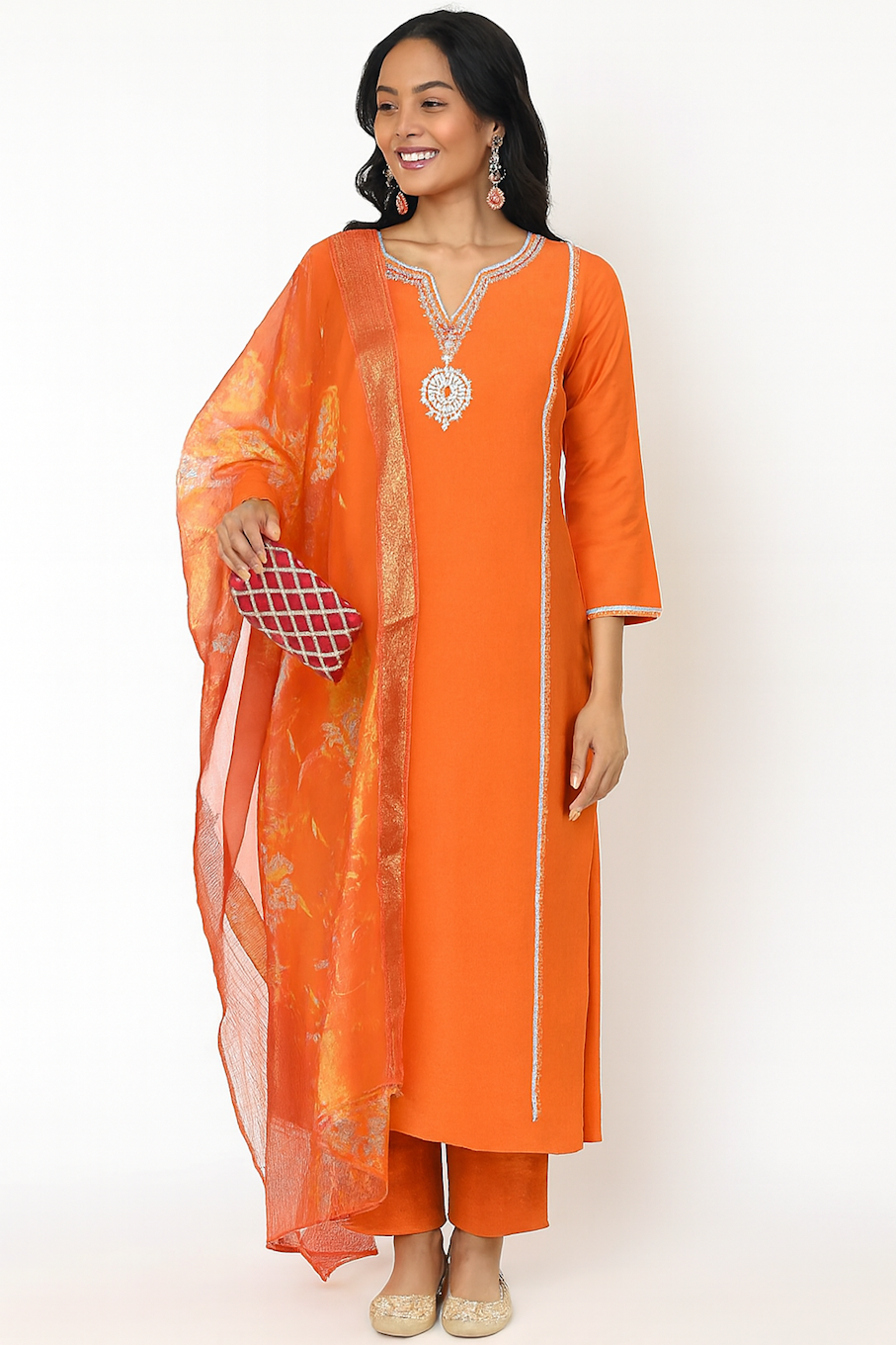 Orange novelty straight kurta and pant set with dupatta by Champagne Thistle, festive wear ensemble with vibrant design.