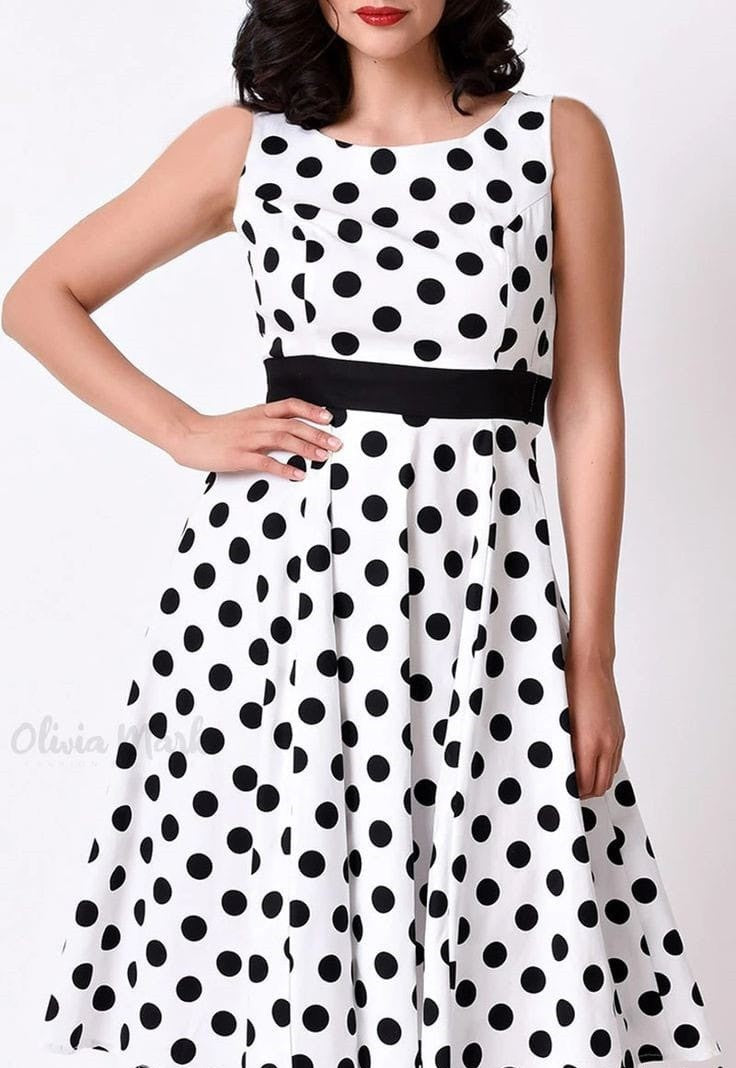 Yellow Castor GB Queen polka dot midi maxi dress for women, flowing fabric with black and white polka dot pattern.