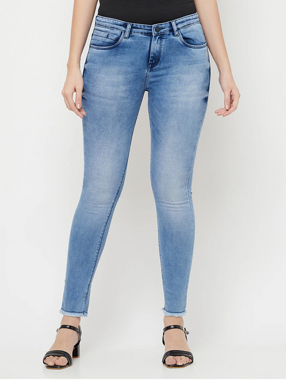 Women’s high rise blue denim jeans by Ochre Ourea, size 30, displayed on a model with a casual fit and classic five-pocket design.