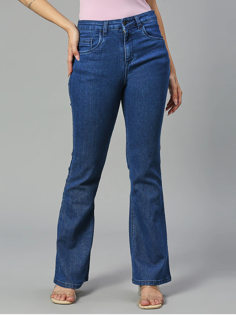 Women’s high-rise blue denim jeans by Ochre Ourea, size 32, displayed on a hanger with visible stitching and classic five-pocket design.