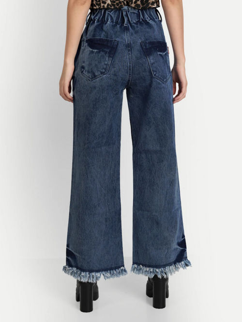 Women’s high rise blue denim jeans by Ochre Ourea, size 32, displayed on a model, showcasing a classic fit and stylish design.