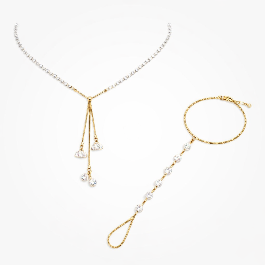 Gold Simba jewelry set with gold chain necklace and bracelet featuring clear gemstones, stylish and elegant accessory duo.