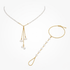 Gold Simba jewelry set with gold chain necklace and bracelet featuring clear gemstones, stylish and elegant accessory duo.