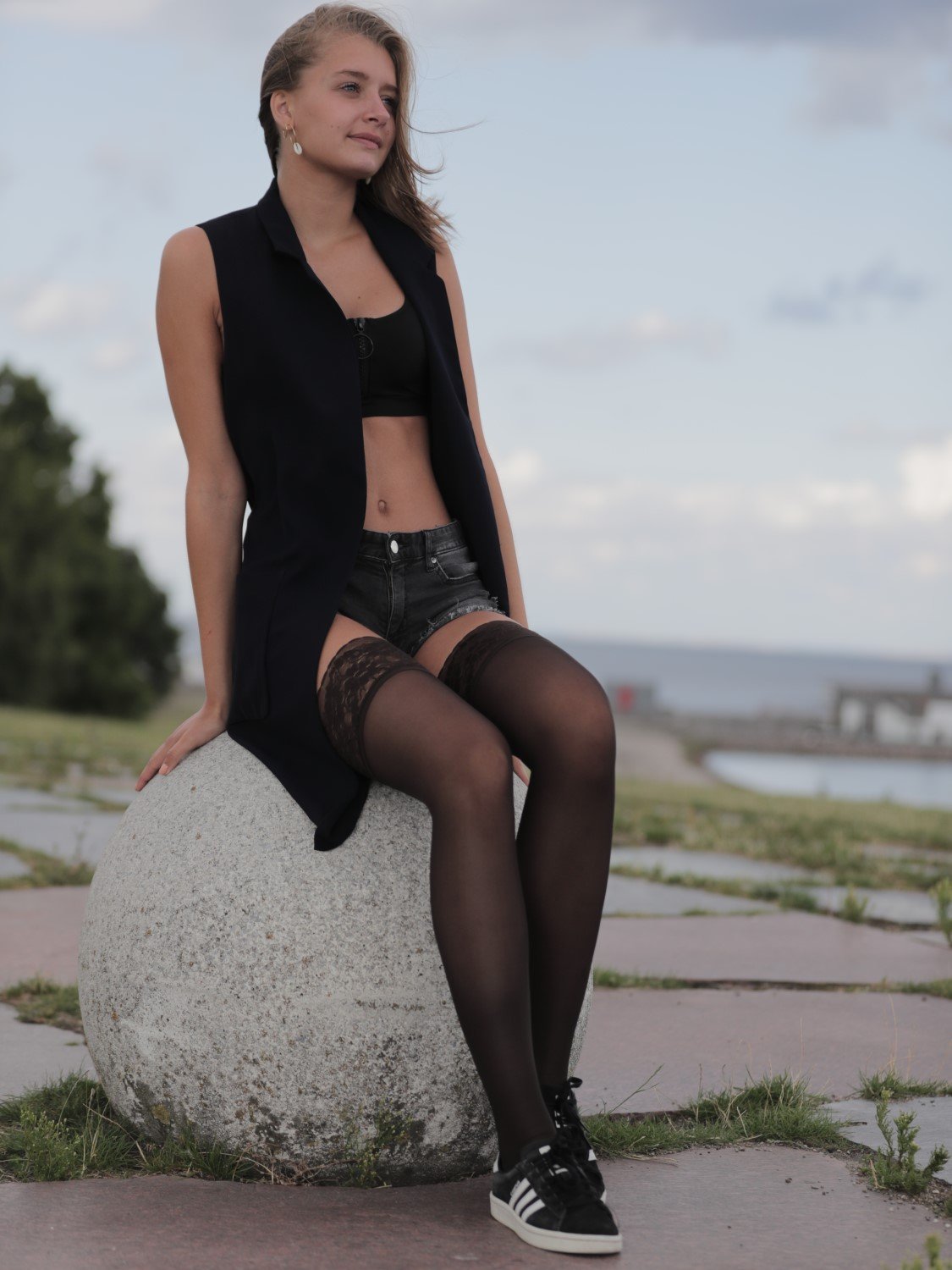 Girl wearing Grey Crius Hosetess Hold Up compression stockings leggings, showcasing the knee-high hosiery with a smooth fit.