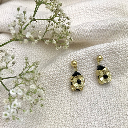 Gold fair trade Keya Flower earrings by Ariel featuring intricate flower-shaped design and elegant gold finish.