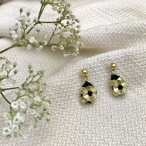 A pair of gold Keya Flower earrings by Ariel featuring floral design and intricate craftsmanship.