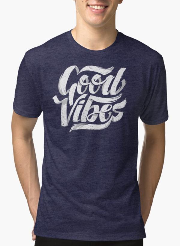 Purple Scorpius Good Vibes Feel Good T-shirt with bold text, casual fit, worn by a model in a relaxed setting.