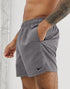 Grey swim shorts by Sky Felix, shown on a model, with a relaxed fit and casual style perfect for beach or poolside wear.