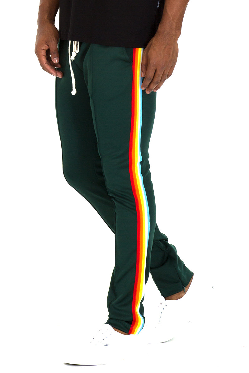 Lime Milo full rainbow track pants with multicolor stripes, elastic waistband and tapered cuffs, casual athletic style.