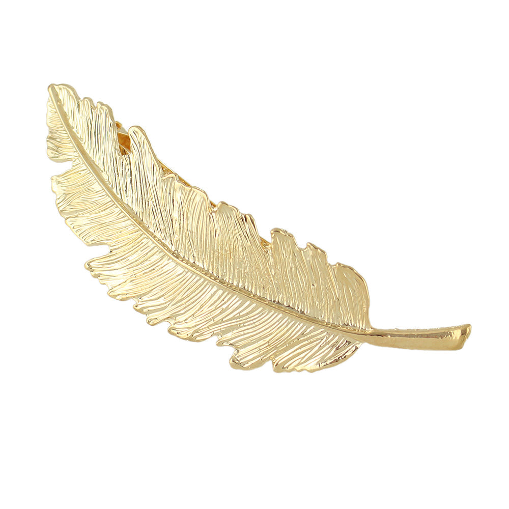 Gold and silver feather metal hair grips by White Demeter, stylish hair clips for elegant hair accessories.