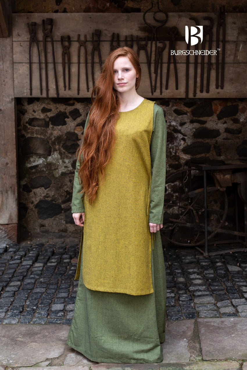 Azure Briseis Over Dress Haithabu in Saffron Yellow, perfect for festivals and parties, featuring flowing fabric and elegant design.