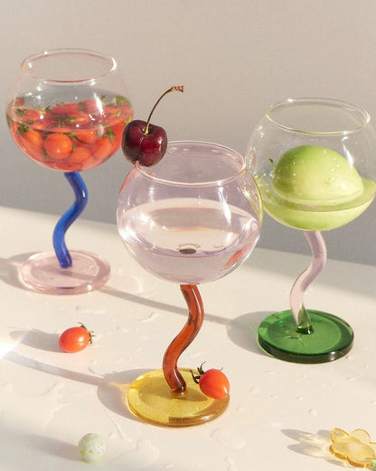Handblown bubble wine glass with a wavy stem, retro design, Burgundy color, perfect for eclectic home decor.