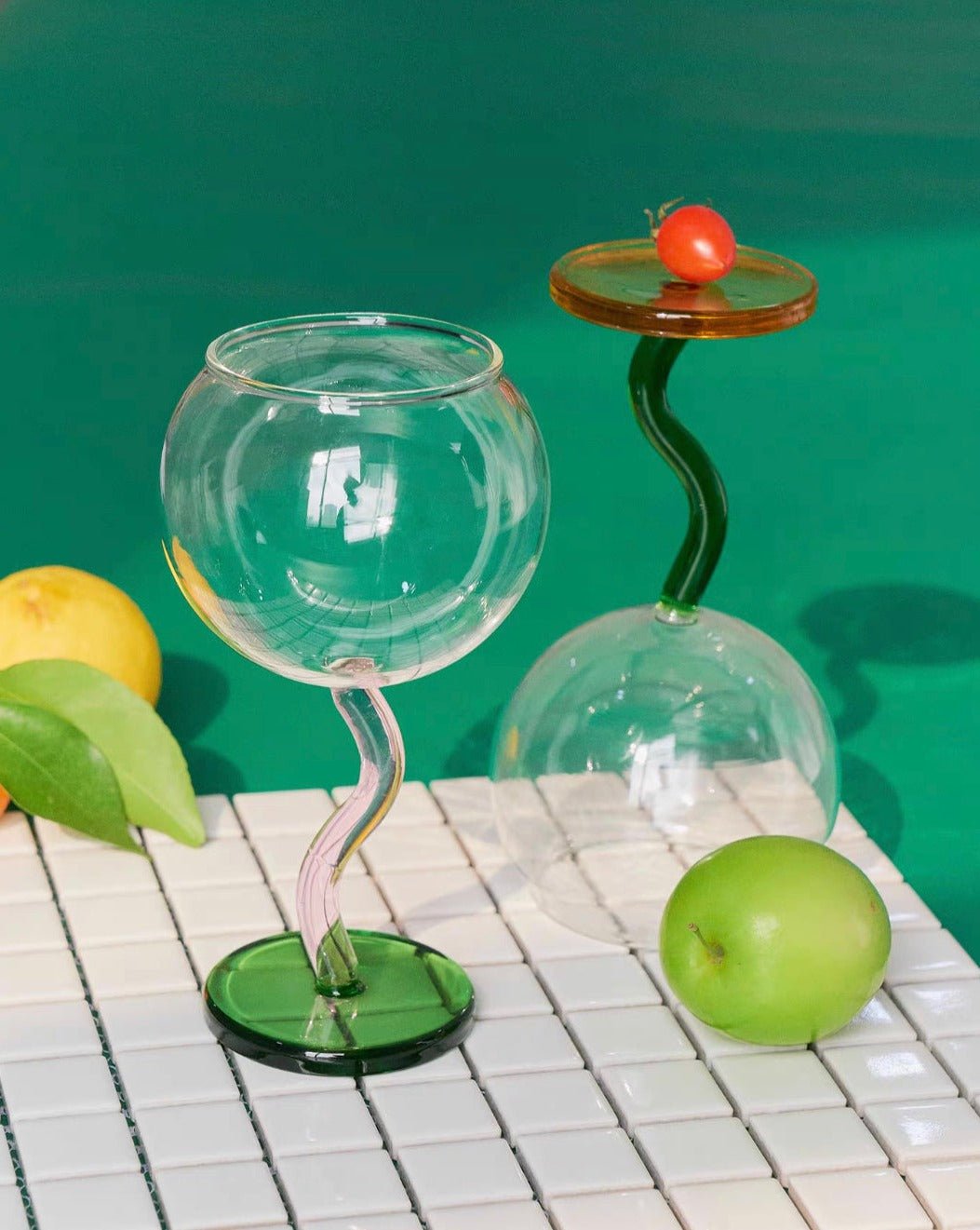 Handblown bubble wine glass with a wavy stem, retro and eclectic style in burgundy, perfect for home decor.