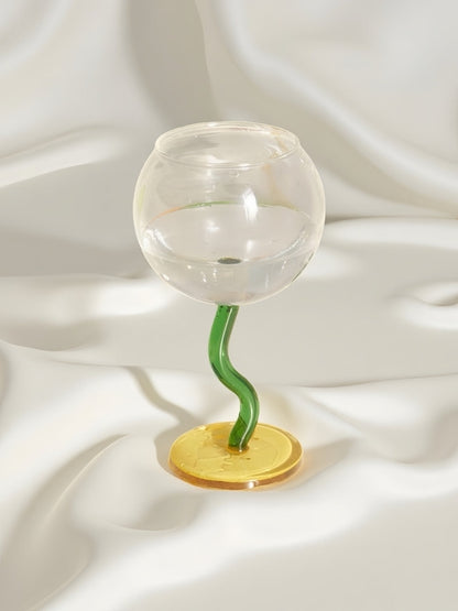 Handblown bubble wine glass with a whimsical retro design, featuring a wavy stem, perfect for eclectic home decor.