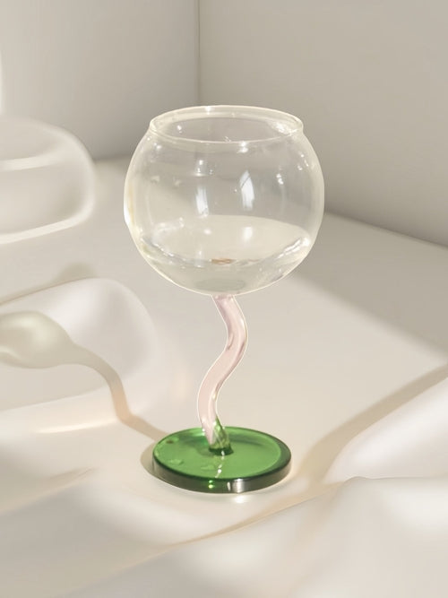 Handblown bubble wine glass with a wavy stem, retro whimsical design, perfect for eclectic home decor by Inspecial Home.