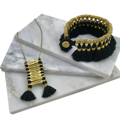 Handmade Kyra Tassel Bracelet by Ariel featuring colorful tassels and beaded details, crafted with fair trade materials.