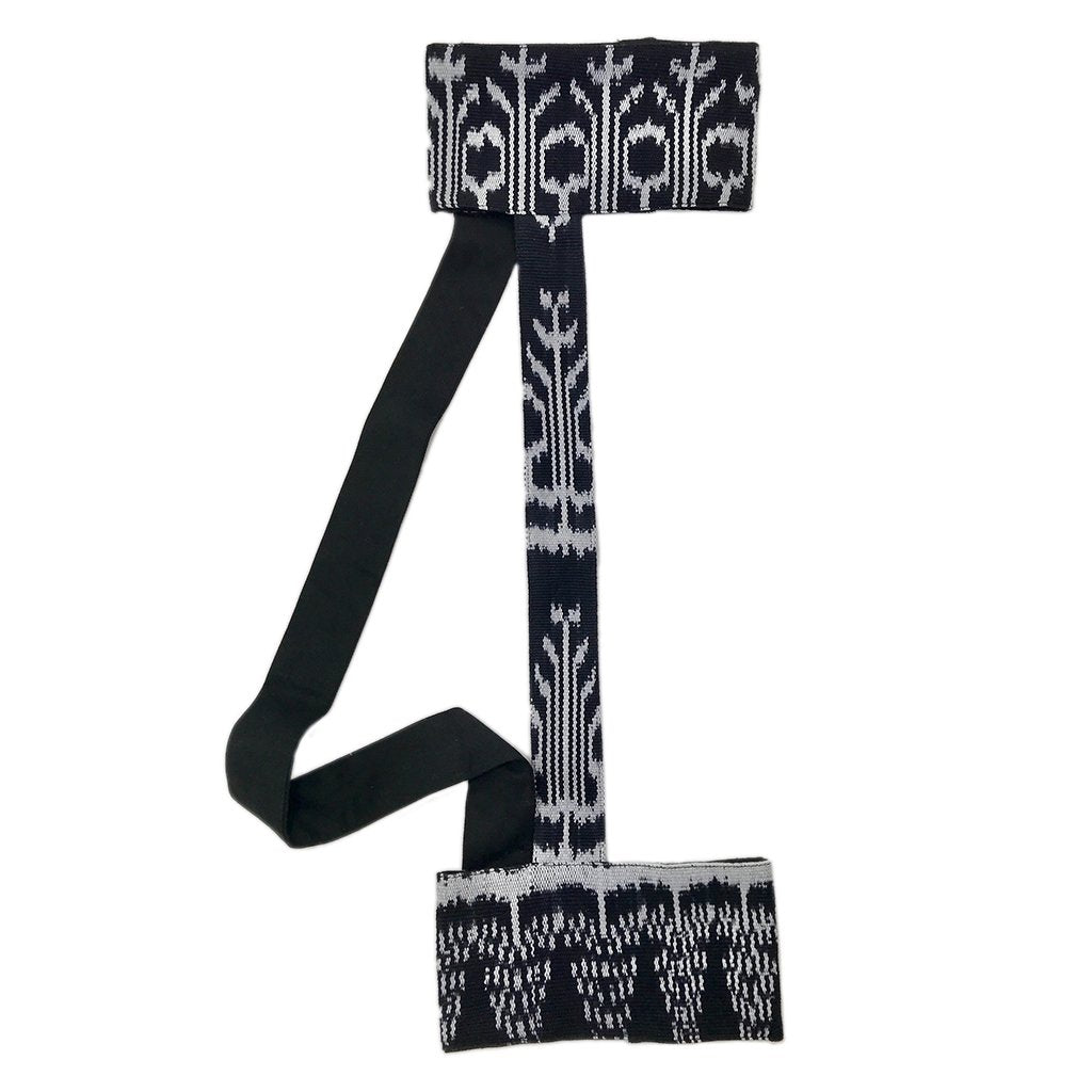 Handmade Ikat fabric yoga strap sling by Ariel, designed for backstrap support and easy transport of yoga mats and accessories.