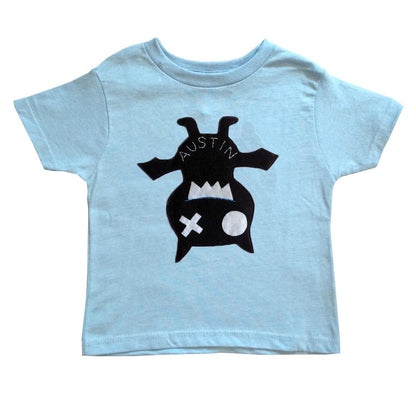 Sky Blue Milo hanging bat kids shirt displayed on a hanger, featuring a playful bat design for toddlers and young children.