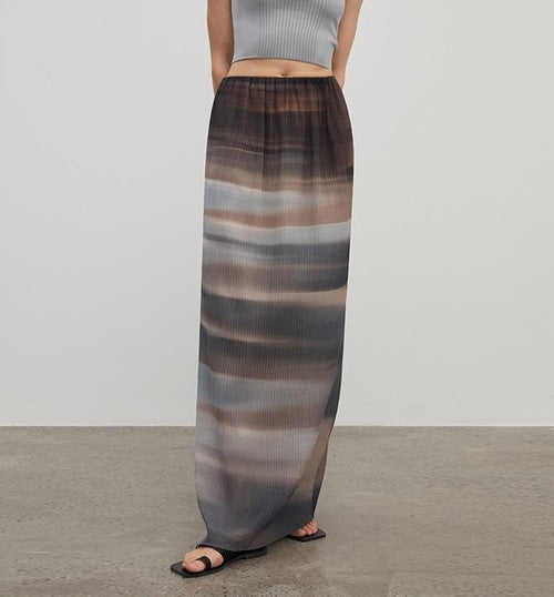 Brown Coeus luxury high-density silk skirt for women, showcasing its elegant fabric and flowing design against a soft background.