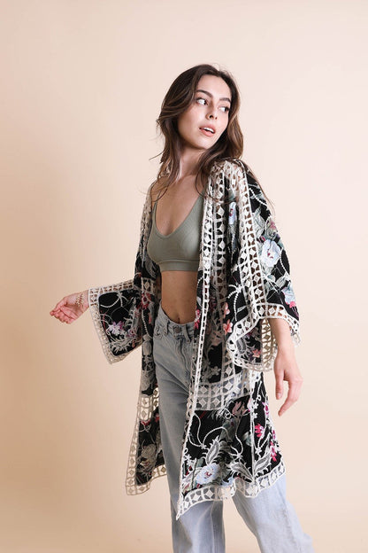 Black heirloom embroidered kimono by Periwinkle Aether, showcasing intricate embroidery and flowing fabric from the Leto collection.