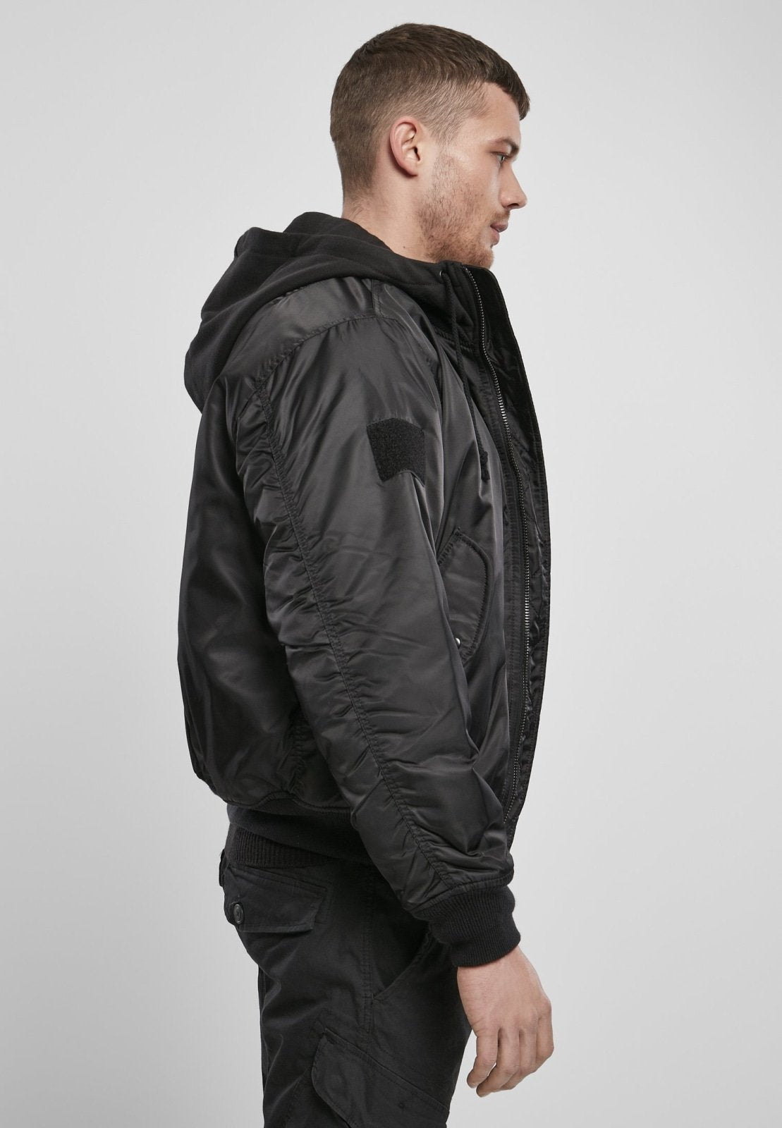 Callisto hooded MA1 bomber jacket with a zipper, ribbed cuffs, and hood, styled for a casual look.