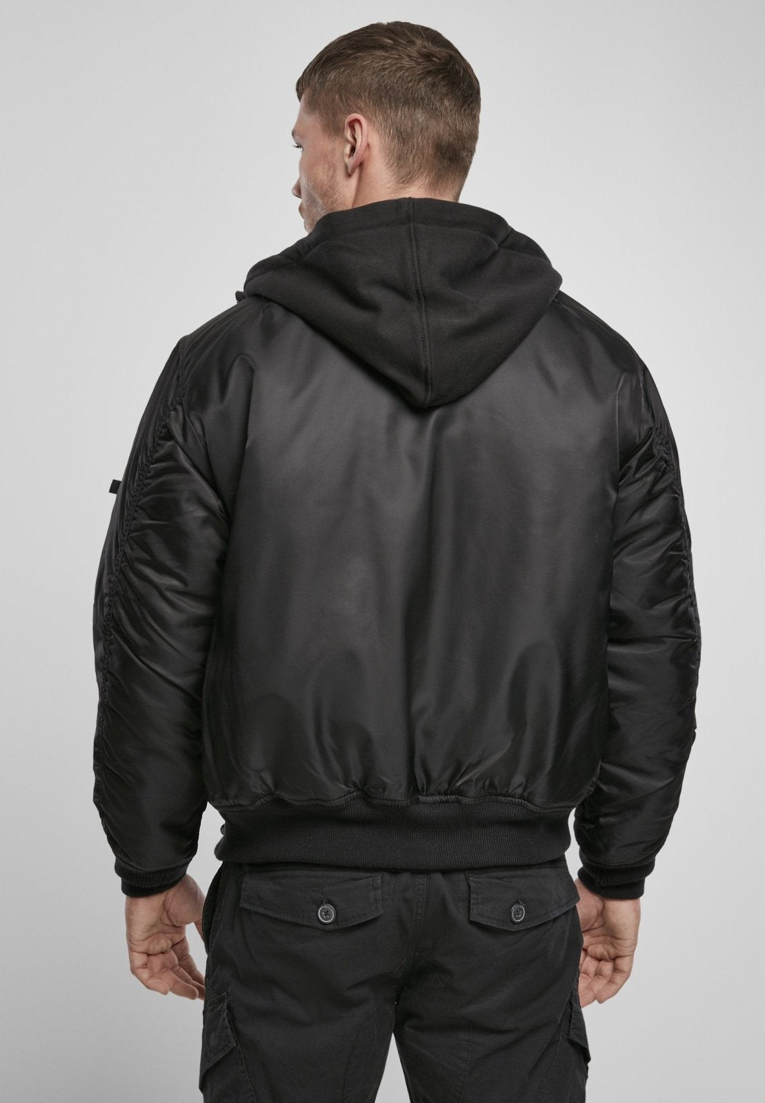 Callisto hooded MA1 bomber jacket with a zip-up front, ribbed cuffs, and a hood, designed for stylish winter wear.