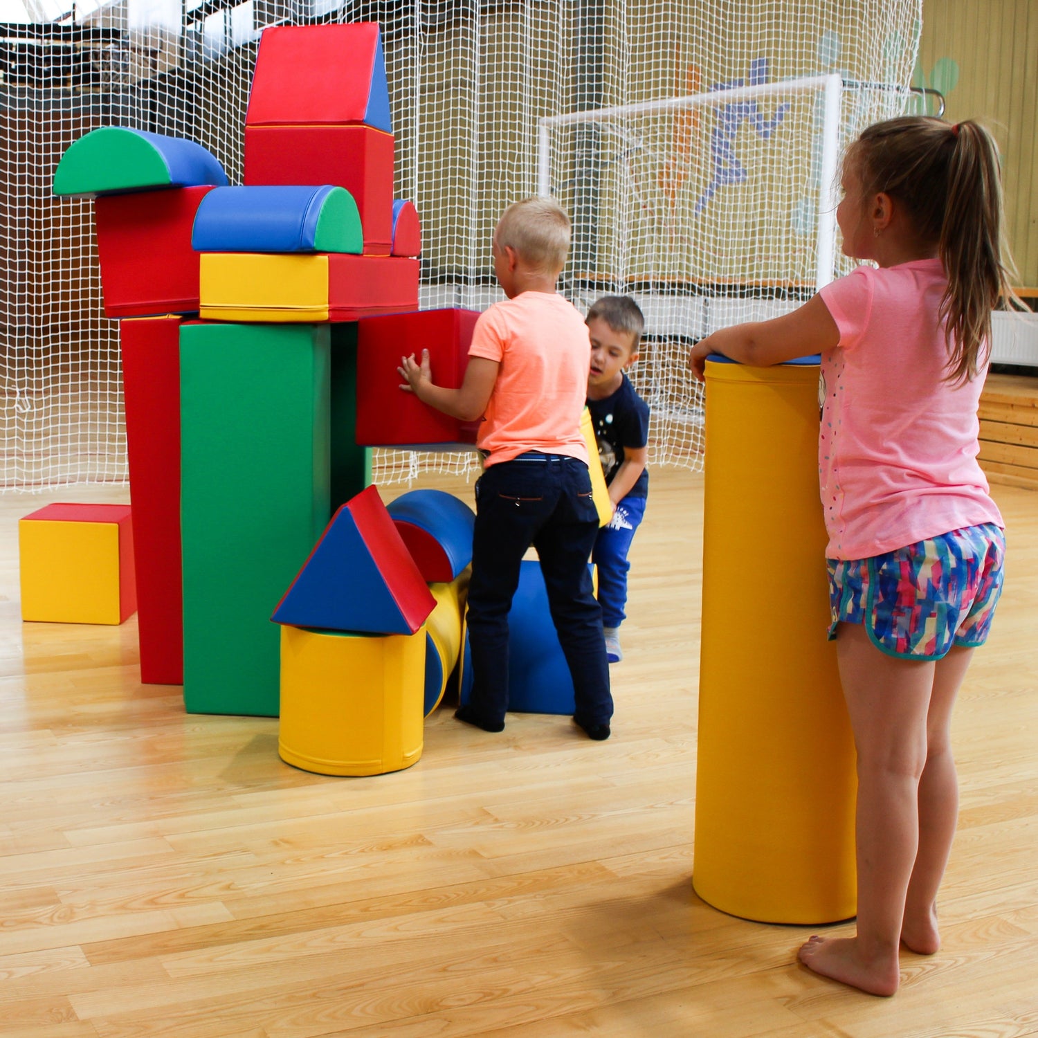 Blush Apricot Mega Fort soft play set with igloo-shaped furniture, colorful cushions, and inviting play area for kids.