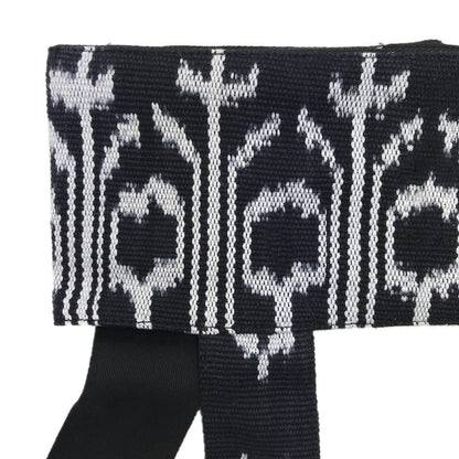 Ariel backstrap yoga mat sling with ikat pattern, designed for carrying and storing yoga mats and accessories.