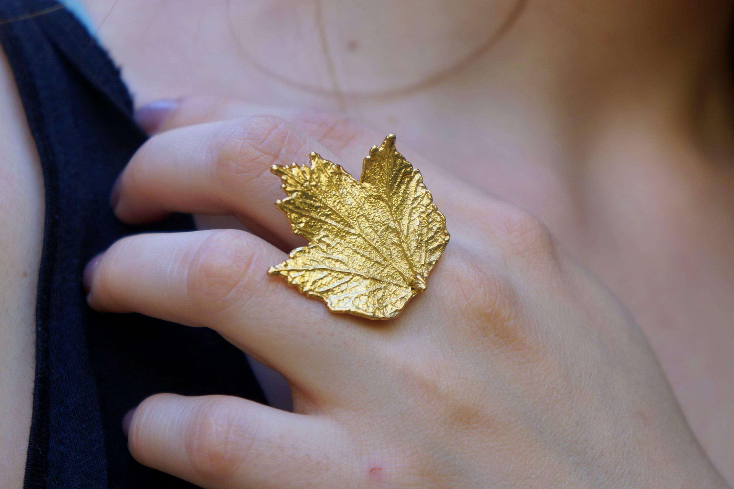 Gold-plated brass Bourbon Rose Leaf ring with adjustable band, featuring detailed rose leaf design, from Beige Briseis jewelry collection.