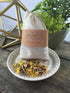 White Smokey Perfect Baby Organic Bath Tea sachet for gentle baby bodycare, featuring calming herbal ingredients in a small cloth pouch.