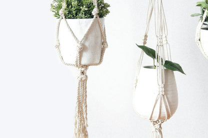 Silver Simba macrame plant hanger for indoor plants, featuring intricate knotted design and natural cotton cords.