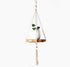 Silver Simba macrame plant hanger with intricate knots, holding a potted plant for home and garden decor.