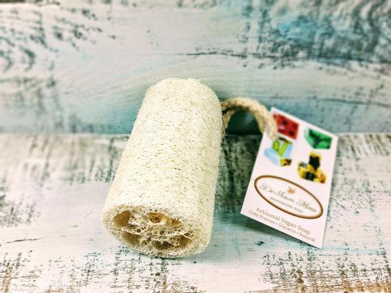 Organic natural 4-inch loofah sponge for bathroom use, showing textured luffa surface from Yellow Shadow.