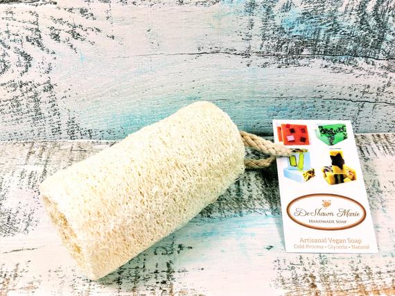 Organic natural 4-inch loofah from Yellow Shadow, showing textured, fibrous vegan bathroom exfoliating sponge.