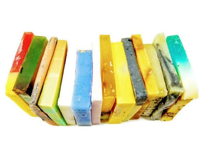 Assorted Yellow Shadow vegan soap samples displayed in a natural setting, showcasing various scents and natural ingredients for bodycare.