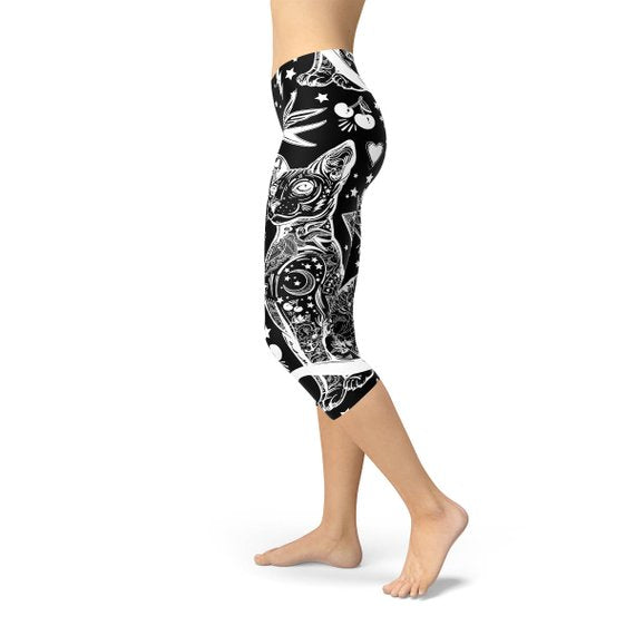 Women’s black magic cat Capri leggings by Maroon Sooty featuring a playful cat print on stretchy, comfortable fabric.