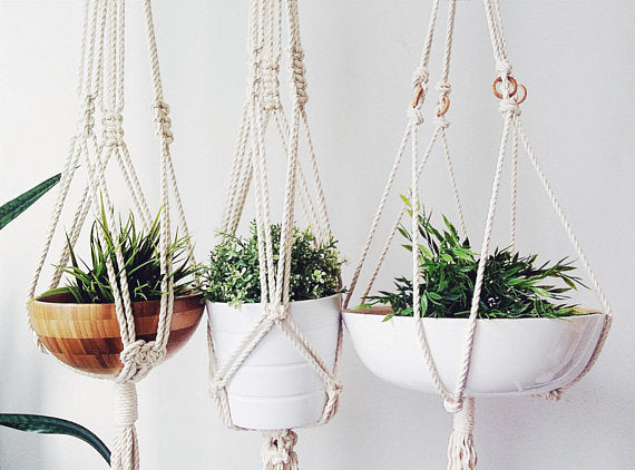 Silver Simba macrame plant hanger for home and garden, featuring woven design and hanging loop for decorative indoor or outdoor plant display.