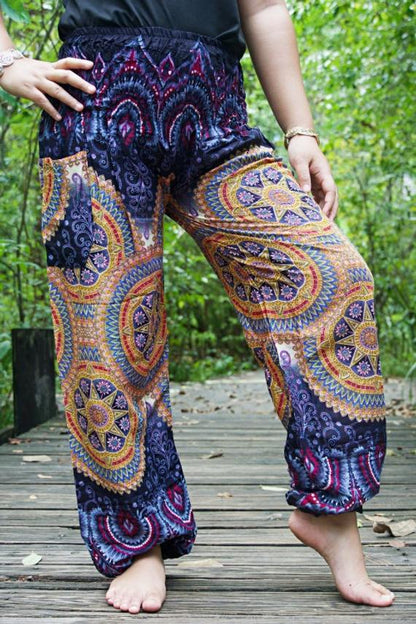 Purple psychedelic boho pants for women by Tan Smokey, featuring a hippie-inspired yoga and casual wear design.