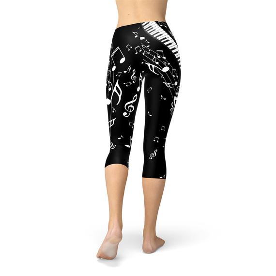 Black Capri leggings for women by Maroon Sooty featuring piano notes print, fitted and comfortable for everyday wear.