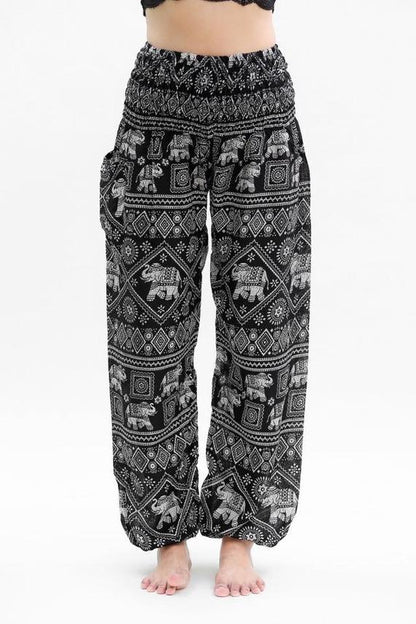 Black boho elephant print pants for women, Tan Smokey hippie yoga pants with relaxed fit and comfortable fabric.
