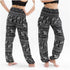 Black elephant print boho pants for women, featuring a relaxed fit and hippie style, perfect for yoga or casual wear.