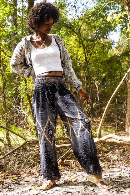 Black PEACOCK women’s boho pants by Tan Smokey, hippie yoga pants with a relaxed fit and bohemian style, shown in the image.