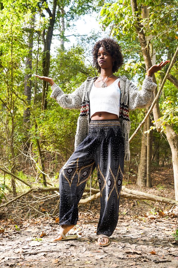 Black PEACOCK women’s boho yoga pants by Tan Smokey, featuring a relaxed fit and intricate peacock feather pattern.