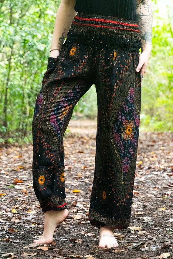 Black PEACOCK harem pants for women by Tan Smokey, boho style with relaxed fit and intricate peacock print detailing.