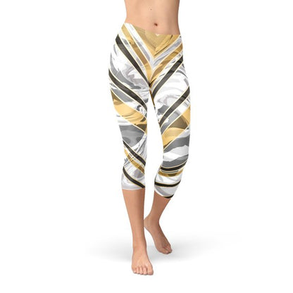 White marble-patterned Capri leggings by Maroon Sooty with black gold line accents, showcasing a stylish and comfortable athletic wear design.