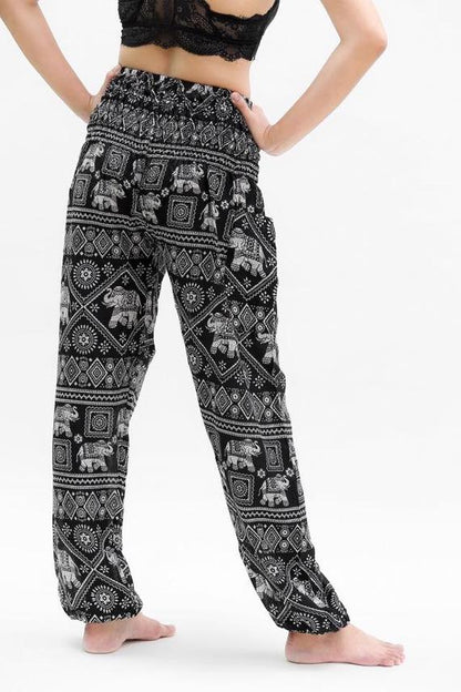 Black elephant print boho pants for women, featuring relaxed fit and hippie style, ideal for yoga and casual wear by Tan Smokey