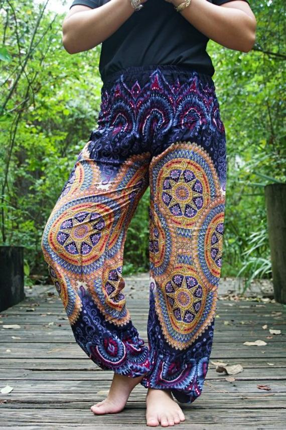 Purple boho yoga pants for women by Tan Smokey featuring psychedelic and hippie-inspired design, relaxed fit and comfortable fabric.