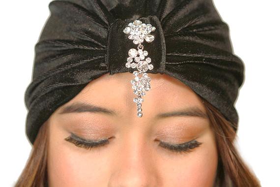 Cyan Ismene cascading crystals turban hat featuring shimmering crystal accents and elegant fabric design.